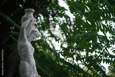 Sculpture Of A Girl In The Spring Park An Old Statue In A Park Of A Sensual Semi Nude Greek Or