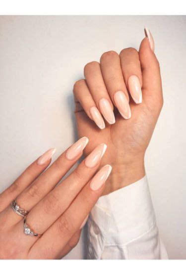 Nude And White Slanted French Tip Nails