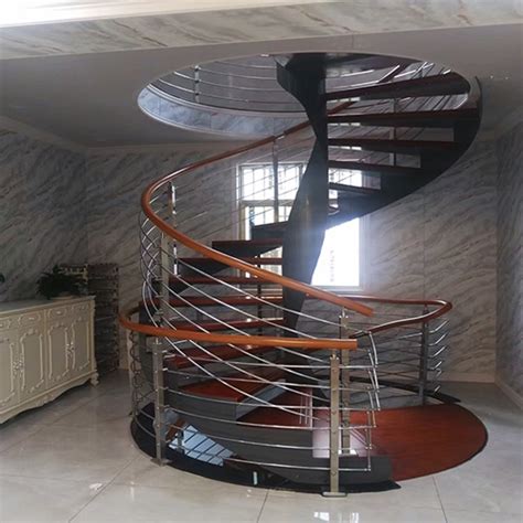 Curved staircase with steel railing | newstarbuilding