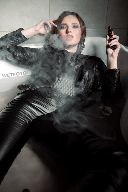 Sexy Girl In Leather Jacket And Leggings Smokes In Jacuzzi