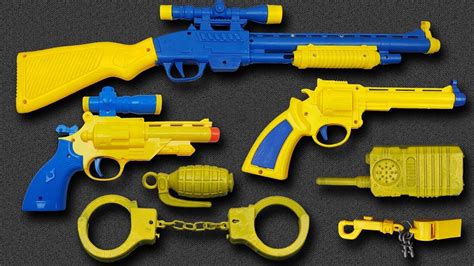 Box Of Toys With Many Yellow Colored Guns Toys Equipment Realistic