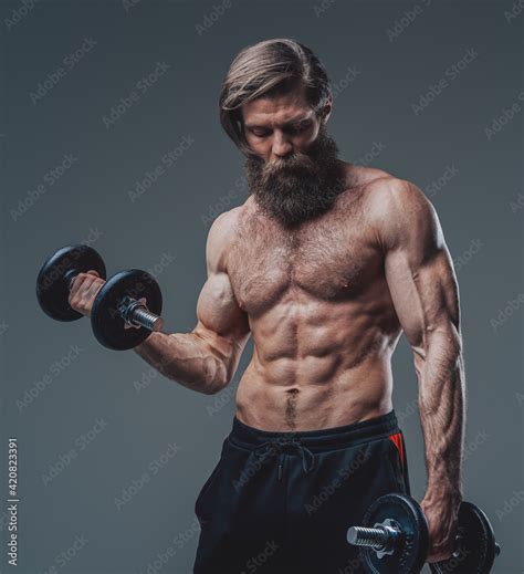 Strong Bodybuilder With Dumbells And Naked Torso Posing In Studio Stock Photo Adobe Stock