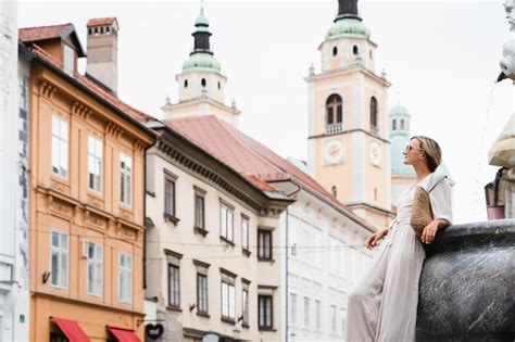 Premium Photo Smiling Woman Enjoying Walking Near The Robba Fountain