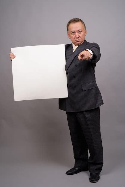 Premium Photo Portrait Of A Man Holding Camera