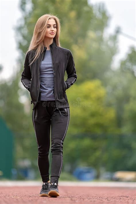 Slim Blonde Woman In The Stadium Sporty Girl With Flat Belly Outdoors Stock Image Image Of