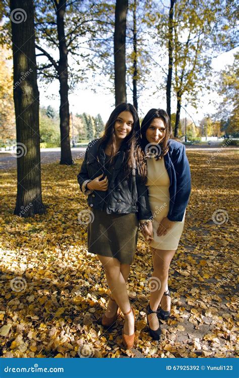 Mature Real Mother With Daughter Outside Autumn Fall In Park Stock