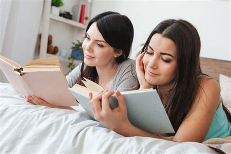 Lesbian Couple In Bedroom At Home Sitting In Sleeping Masks Taking