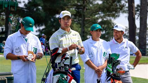 Hideki Matsuyama Of Japan And Xander Schauffele Wait With Their Caddies