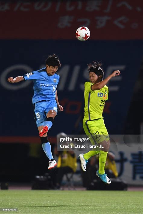 Sanfrecce Hiroshima X Kawasaki Frontale - Shogo Taniguchi of Kawasaki Frontale and Yusuke Minagawa of Sanfrecce ...