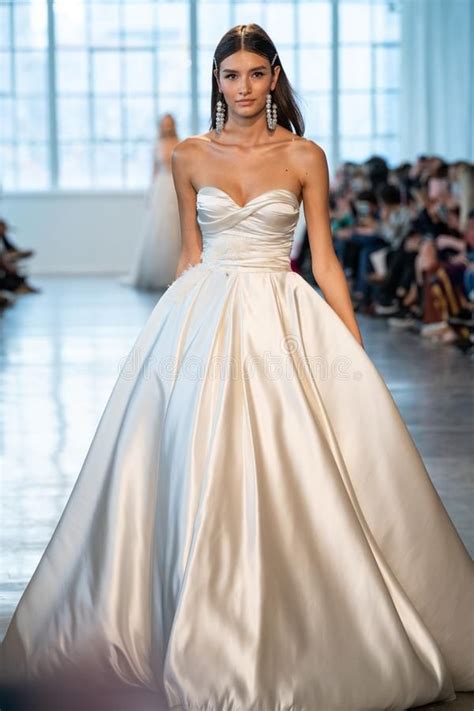 A Model Walks The Runway During The Berta Bridal Spring Fashion