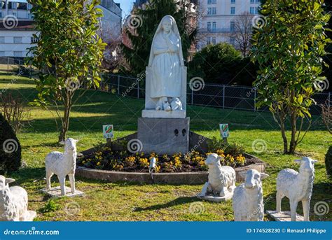 Statue of Bernadette of Lourdes with Flowers Stock Photo - Image of prayer, historic: 174528230