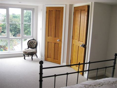 Large Feature Window Creating A Light Fresh Loft Conversion Bedroom