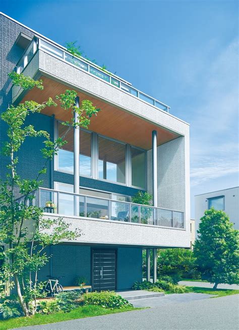 An Apartment Building With Balconies On The Second Floor