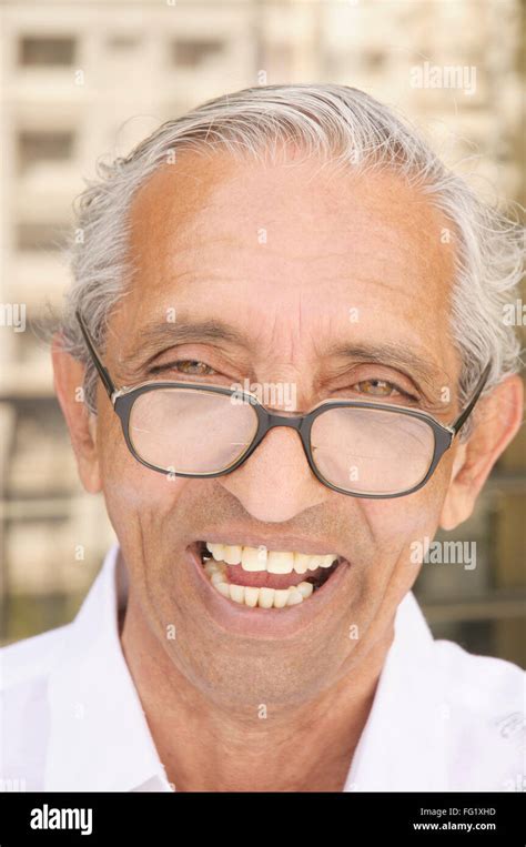 Sixty Four Year Old Man Wearing Spectacles Wryly Smiling Mr686n Stock