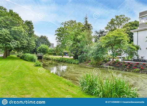 The Garden Of A House Next To A River Editorial Stock Photo Image Of