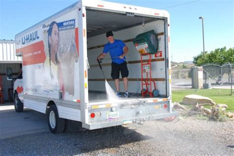 A Man Cleaning The Inside Of A 17ft U Haul Truck U Haul Truck