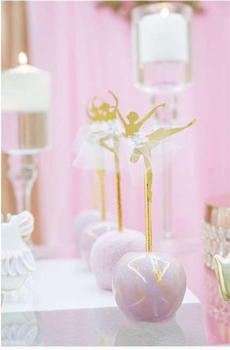 Take A Look At The Stunning Pink Cake Pops Topped With A Gold Ballerina