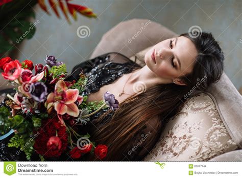 Beautiful Young Sweet Blonde Girl With A Wedding Bouquet In The Hands