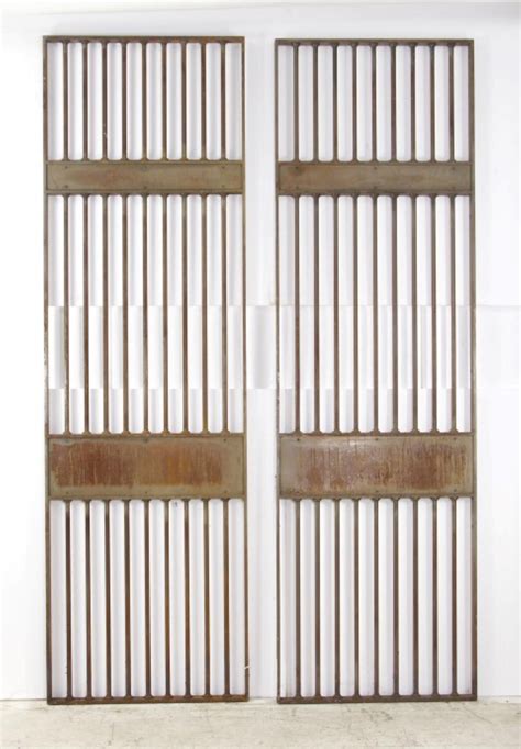 Pair of Industrial Steel Bank Vault Doors with Bars from NYC For Sale