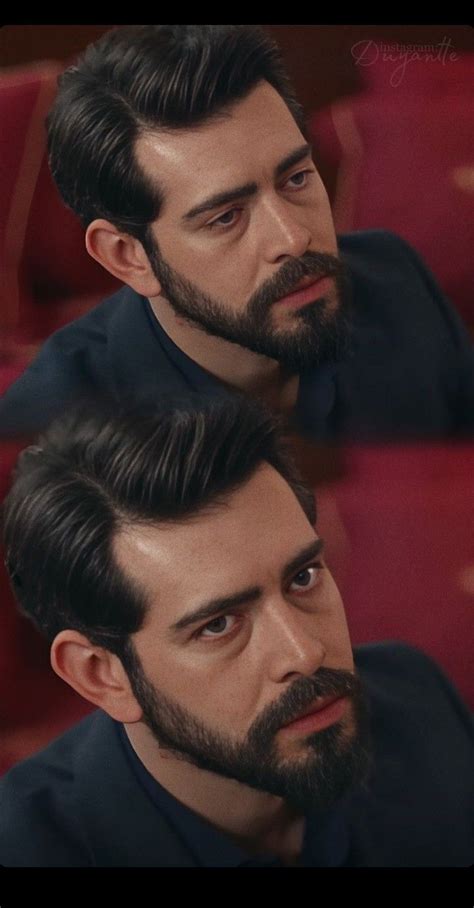 Two Men With Beards Sitting Next To Each Other In Front Of A Red Chair