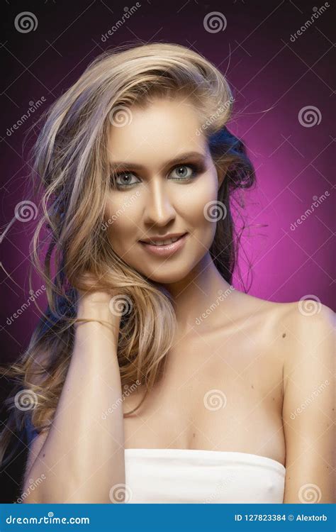 Beautiful Blonde Smiling Model Girl With Naked Shoulders Touches Stock