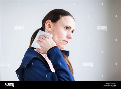 Woman Using A Hot Cold Gel Pack Treatment To Releive Pain Stock Photo Alamy