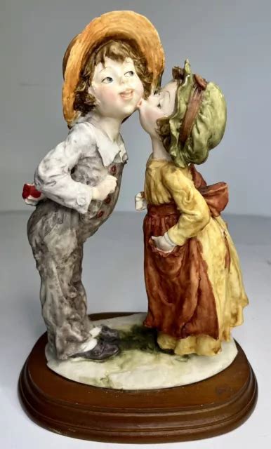 Italian Capodimonte Giuseppe Armani Girl And Boy Sharing Kiss Statue