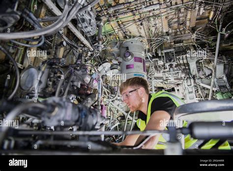 Man Working Inside Airplane Stock Photo Alamy