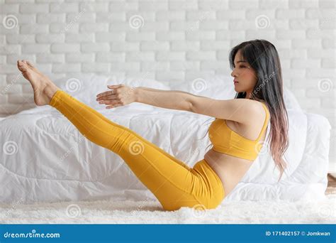 Attractive Asian Woman Practice Yoga Pose To Meditation In Bedroom