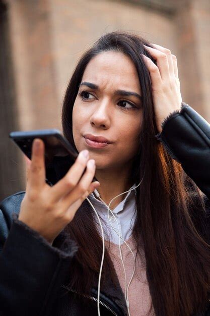 Premium Photo Worried Woman Recording A Voice Message With Phone