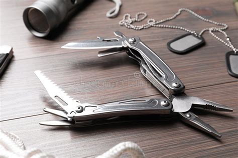 Modern Compact Portable Multitool On Grey Table Space For Text Stock