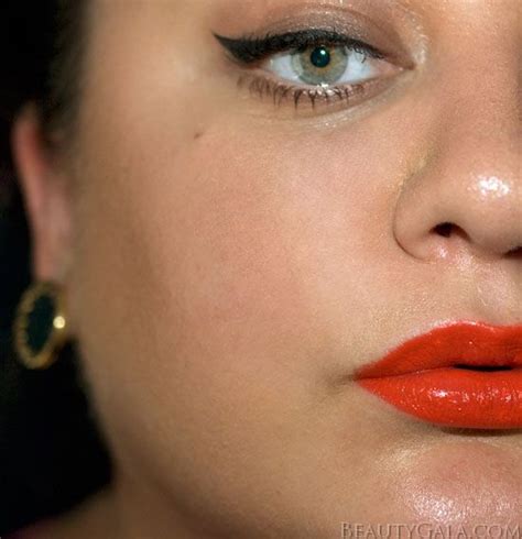 Poppy Colored Lipstick And Winged Liner Nostril Hoop Ring Septum Ring