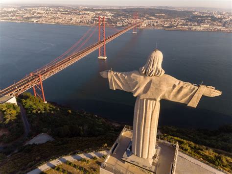 Areal View Drone Shot Of The Cristo Rei Monument From Behind In