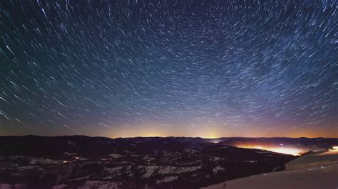 Starry sky during sunrise in the mountains - Free Stock Video