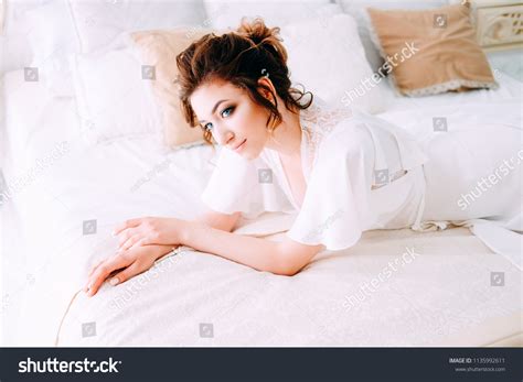 Sensual Brunette Silk White Robe Waiting Stock Photo 1135992611
