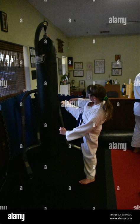 This action photo is of my daughter in her Karate class. Karate is a ...