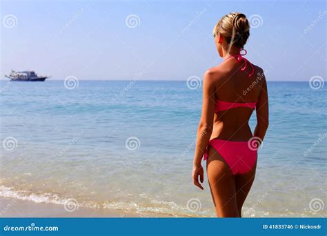 Woman In Pink Bikini Standing On The Beach Stock Photo Image Of