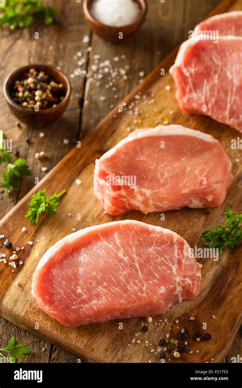 Raw Organic Boneless Pork Chops Ready To Cook Stock Photo Alamy