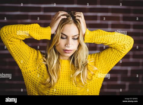 Beautiful Blonde Woman Holding Her Head Stock Photo Alamy