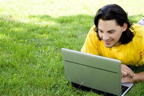 Man using laptop outdoors stock photo. Image of summer - 5989598