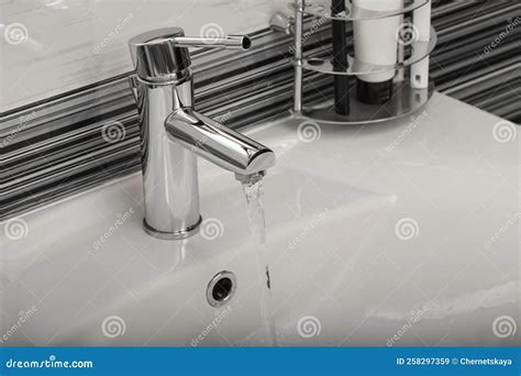 Stream Of Water Flowing From Tap In Bathroom Stock Image Image Of