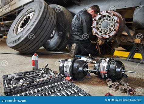 Truck Repair Service Mechanic Works With Brakes In Truck Workshop