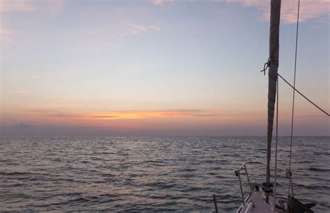 Baggrunde sollys landskab mennesker skib båd solnedgang hav