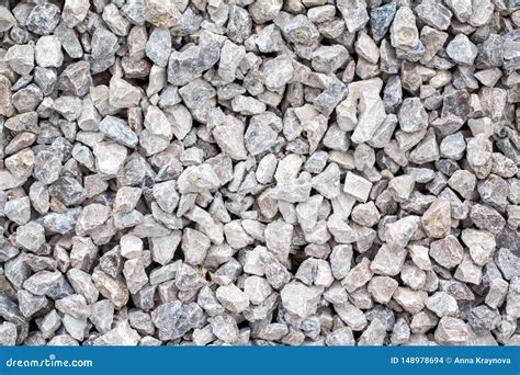 Texture Background Of Small Cracked Stones Rocks Pavement Stock Photo