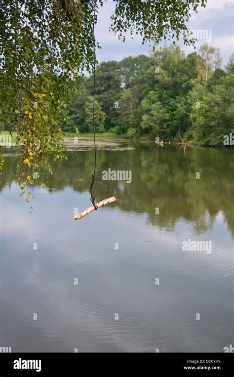 rope swing at the lake Stock Photo - Alamy