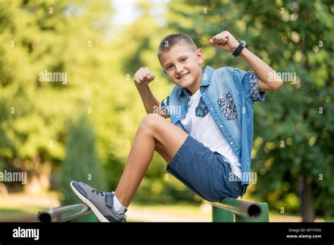 Boy Flexing Muscles Hi Res Stock Photography And Images Alamy