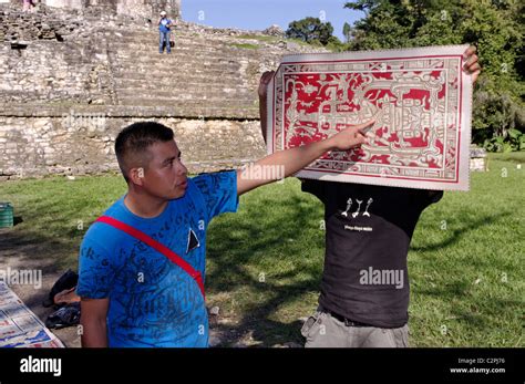 Mayan Guide Explaining A Drawing Of Pakal Tomb To Tourists In Palenque