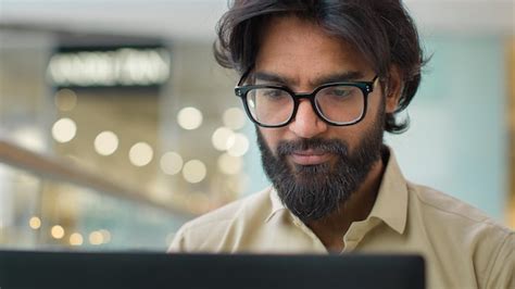 Premium Photo Indian Man In Glasses Looking At Laptop Screen Working