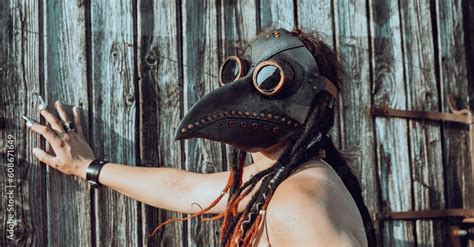 Nude Woman With Plague Raven Mask Near Old Wooden Fence Stock Photo Adobe Stock