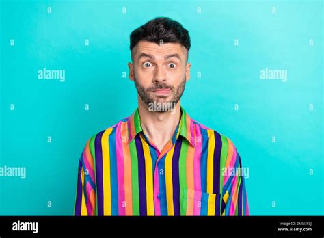 Portrait Of Positive Good Mood Guy With Brunet Haircut Wear Colorful Shirt Having Fun Showing